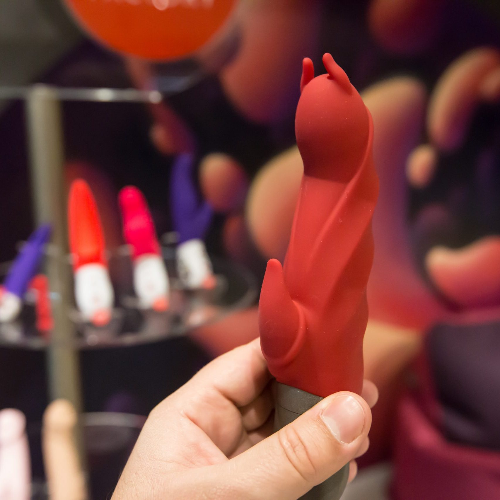 The,Buyer,Considers,The,Vibrator,In,A,Sex,Shop,In